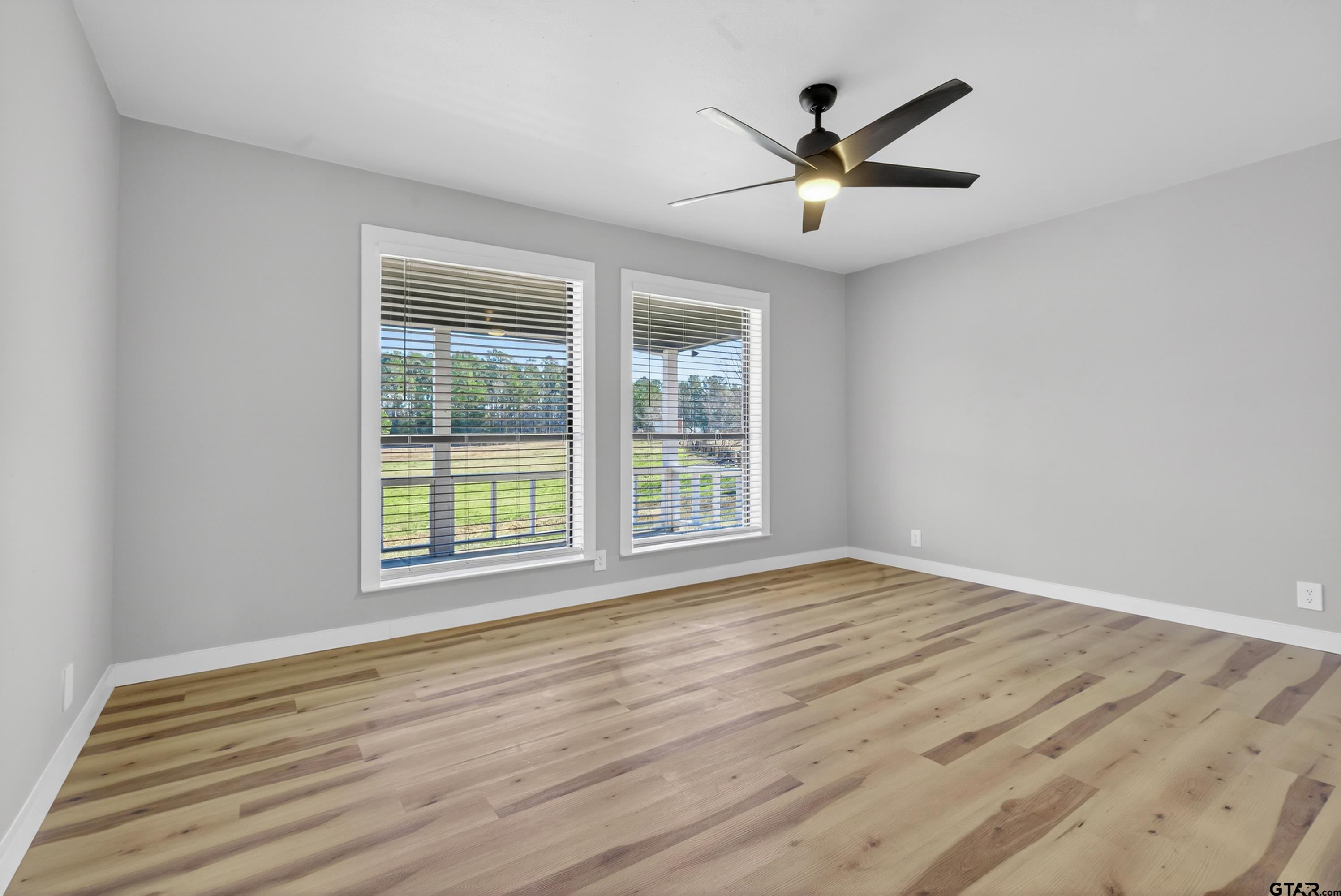 10418 East Fm 2011 Longview, TX 75603 - Photo 38 of 45 a view of an empty room with wooden floor and a window