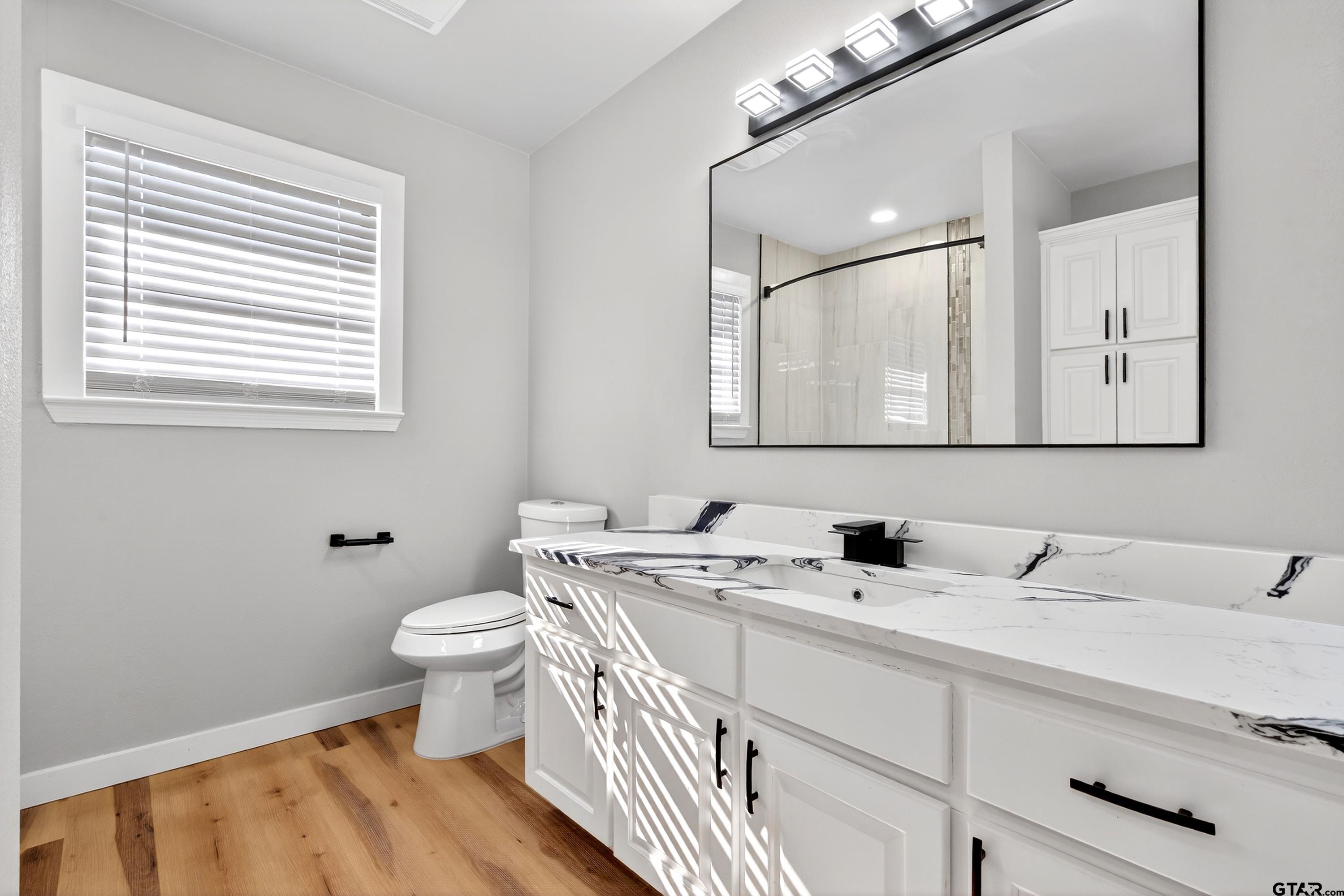10418 East Fm 2011 Longview, TX 75603 - Photo 40 of 45 a bathroom with a sink and a toilet