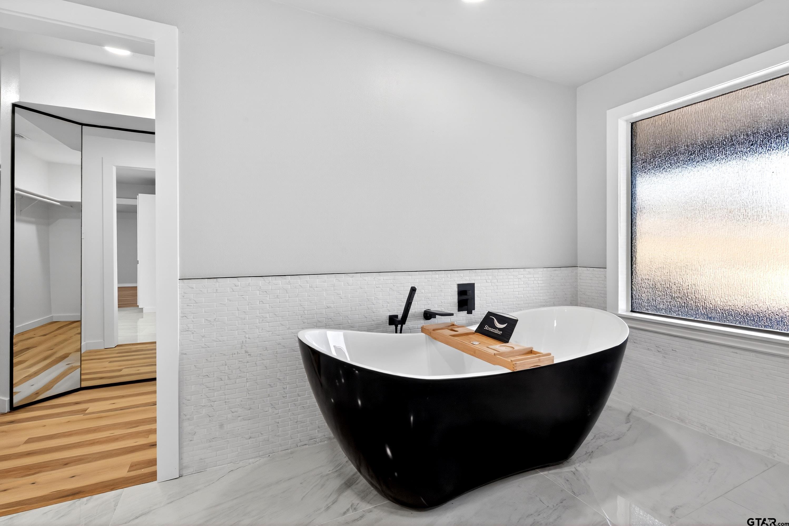 10418 East Fm 2011 Longview, TX 75603 - Photo 43 of 45 a room with a sink and mirror