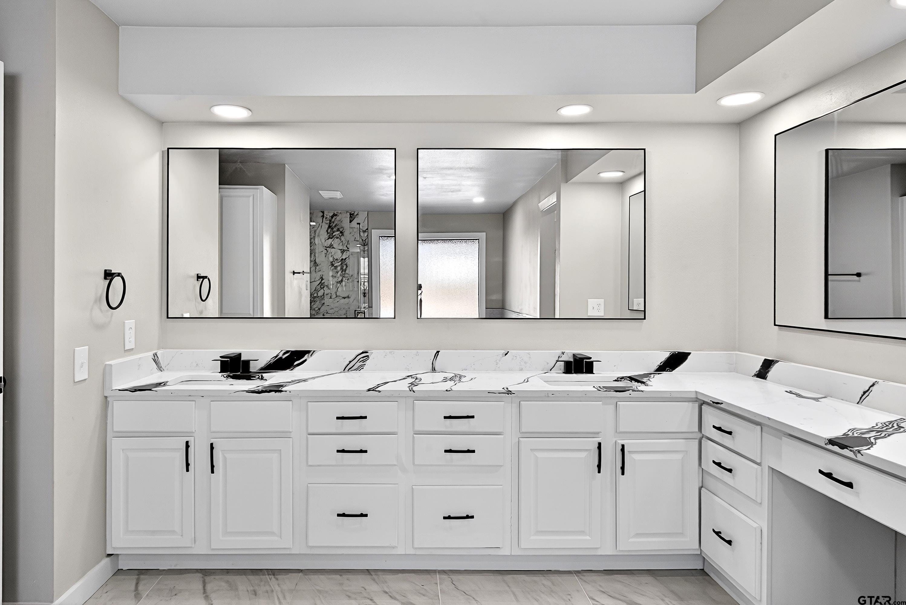 10418 East Fm 2011 Longview, TX 75603 - Photo 44 of 45 a bathroom with double sink and a mirror