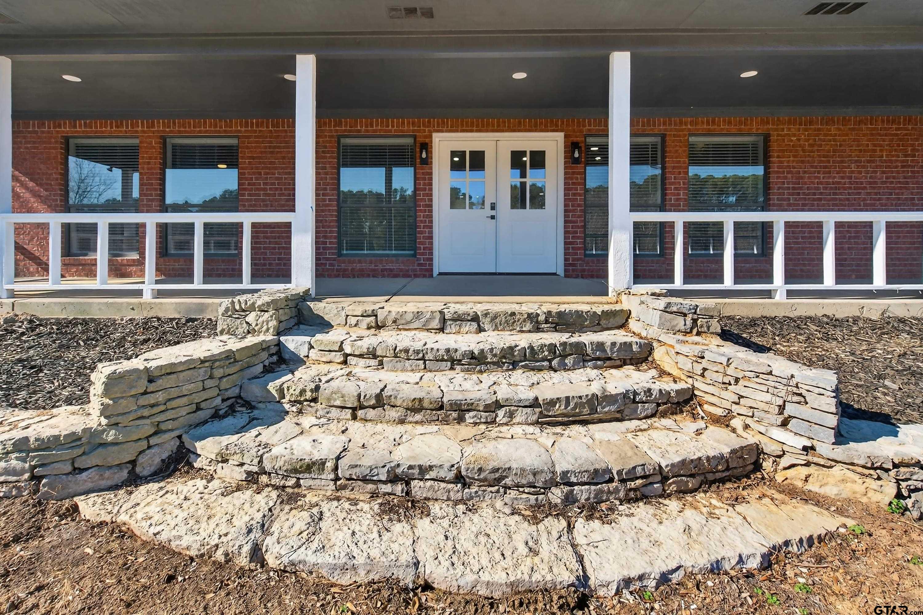 10418 East Fm 2011 Longview, TX 75603 - Photo 6 of 45 a large bed sitting in front of a house