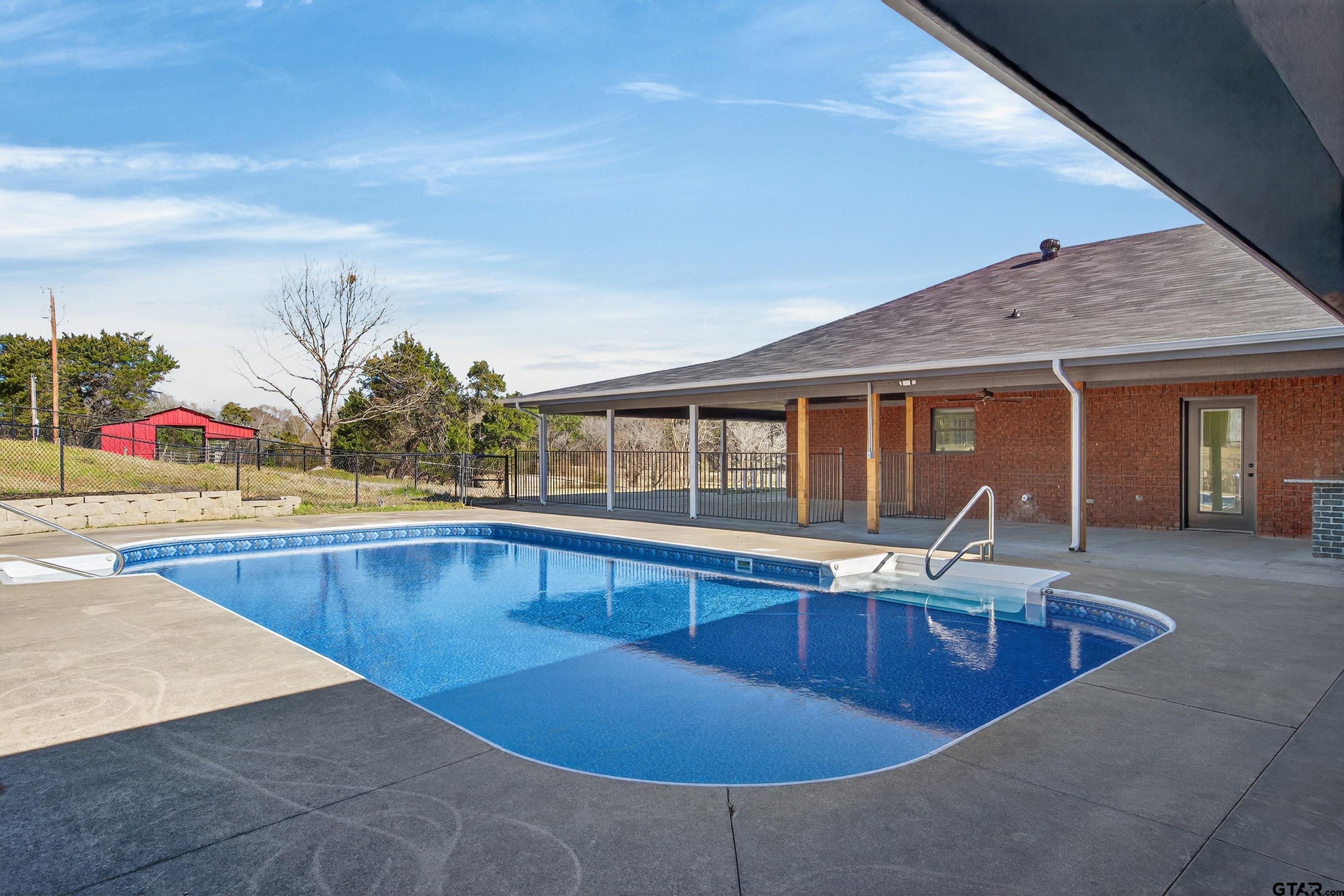10418 East Fm 2011 Longview, TX 75603 - Photo 10 of 45 a view of swimming pool with outdoor seating