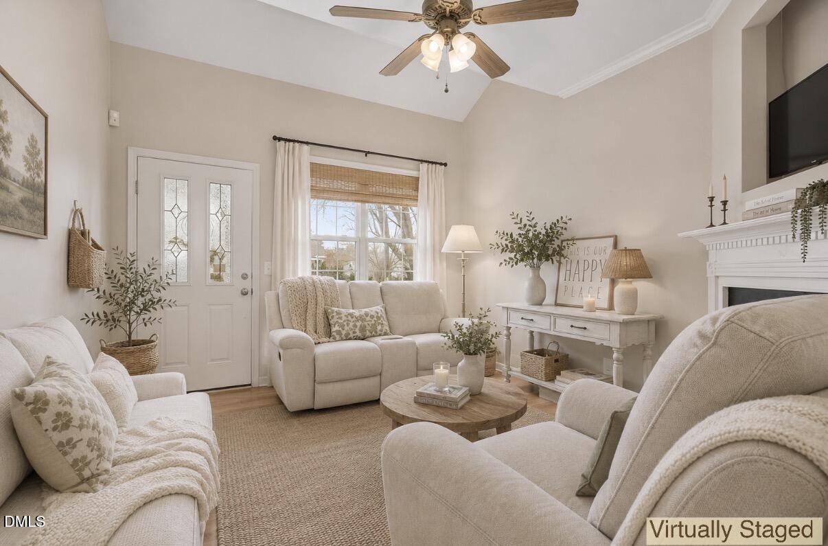 2907 Andover Glen Road Raleigh, NC 27604 - Photo 8 of 39 a living room with furniture and a fireplace