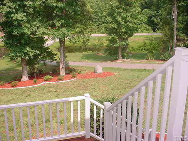3437 Old Milburnie Road Raleigh, NC 27616 - Photo 8 of 10 a view of a wooden deck and a backyard