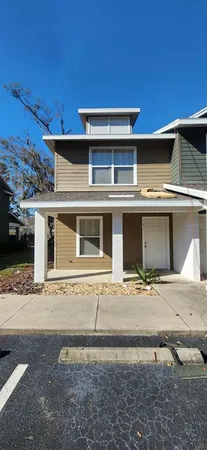 a front view of a house with a garage