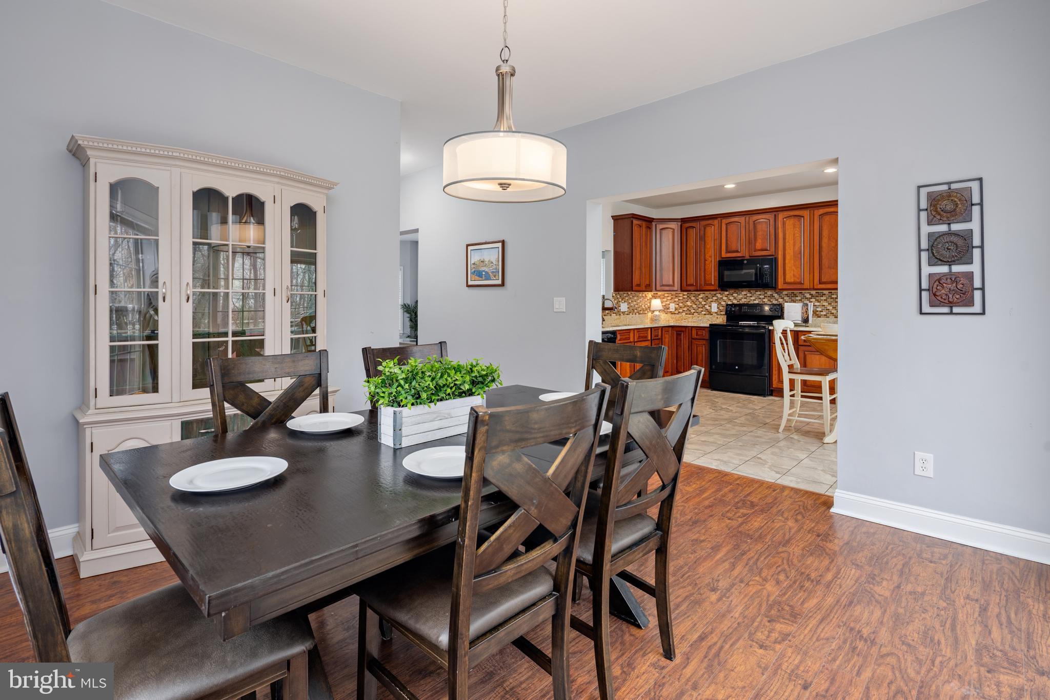 326 South Carolina Road Stevensville, MD 21666 - Photo 13 of 48 a view of a dining room with furniture and wooden floor