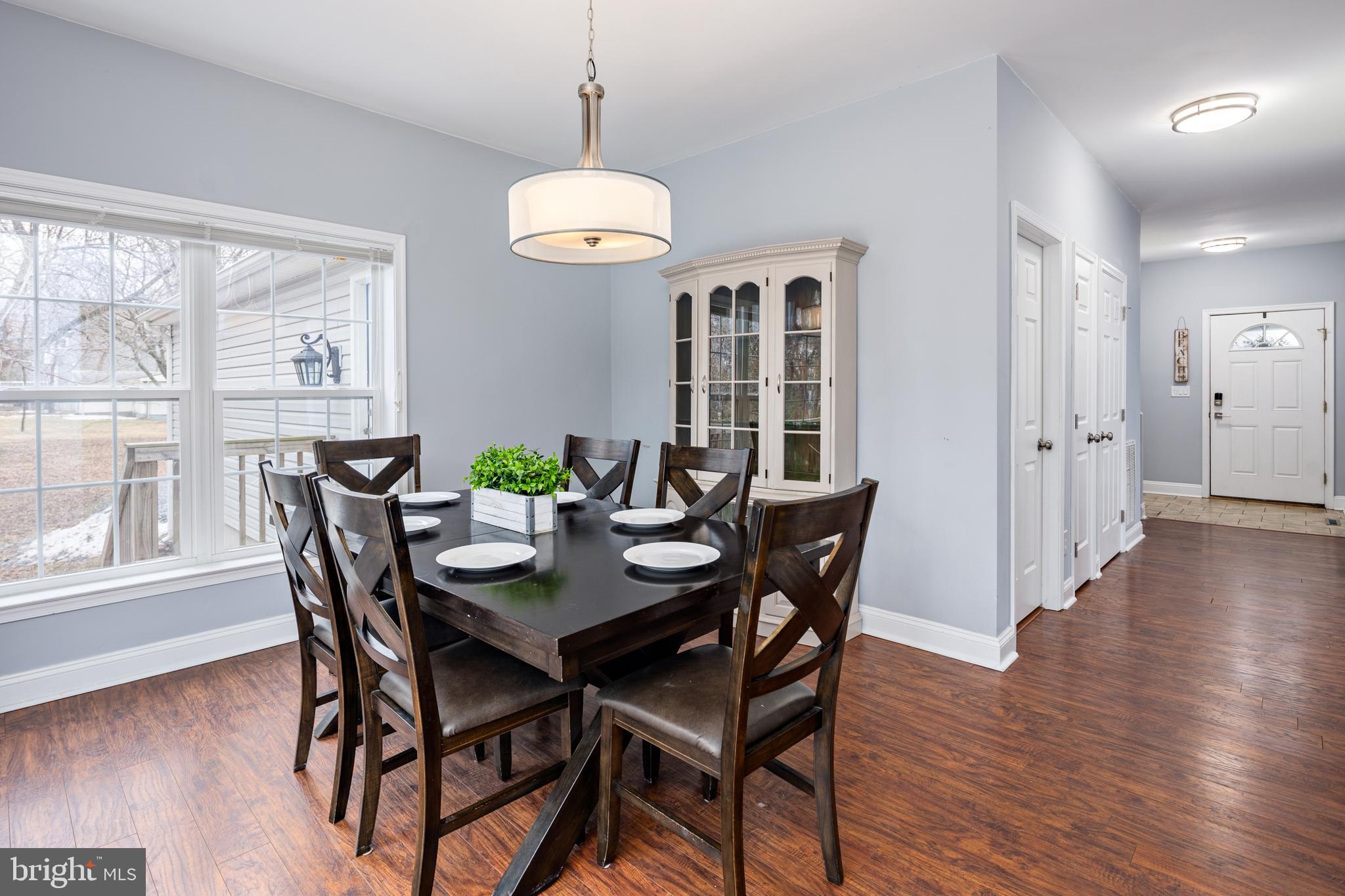 326 South Carolina Road Stevensville, MD 21666 - Photo 15 of 48 a view of a dining room with furniture window and wooden floor