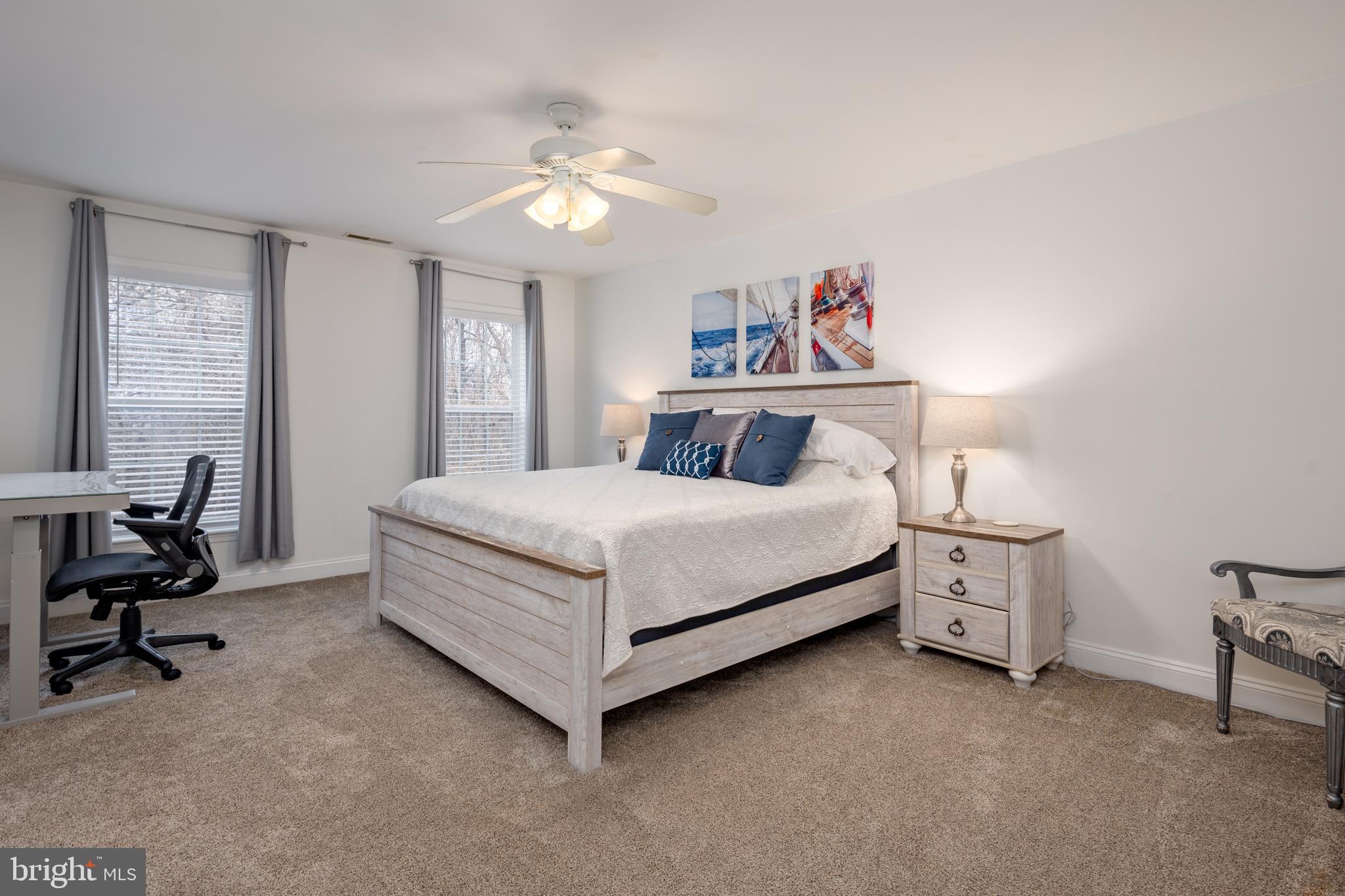 326 South Carolina Road Stevensville, MD 21666 - Photo 18 of 48 a bedroom with a bed and a chandelier