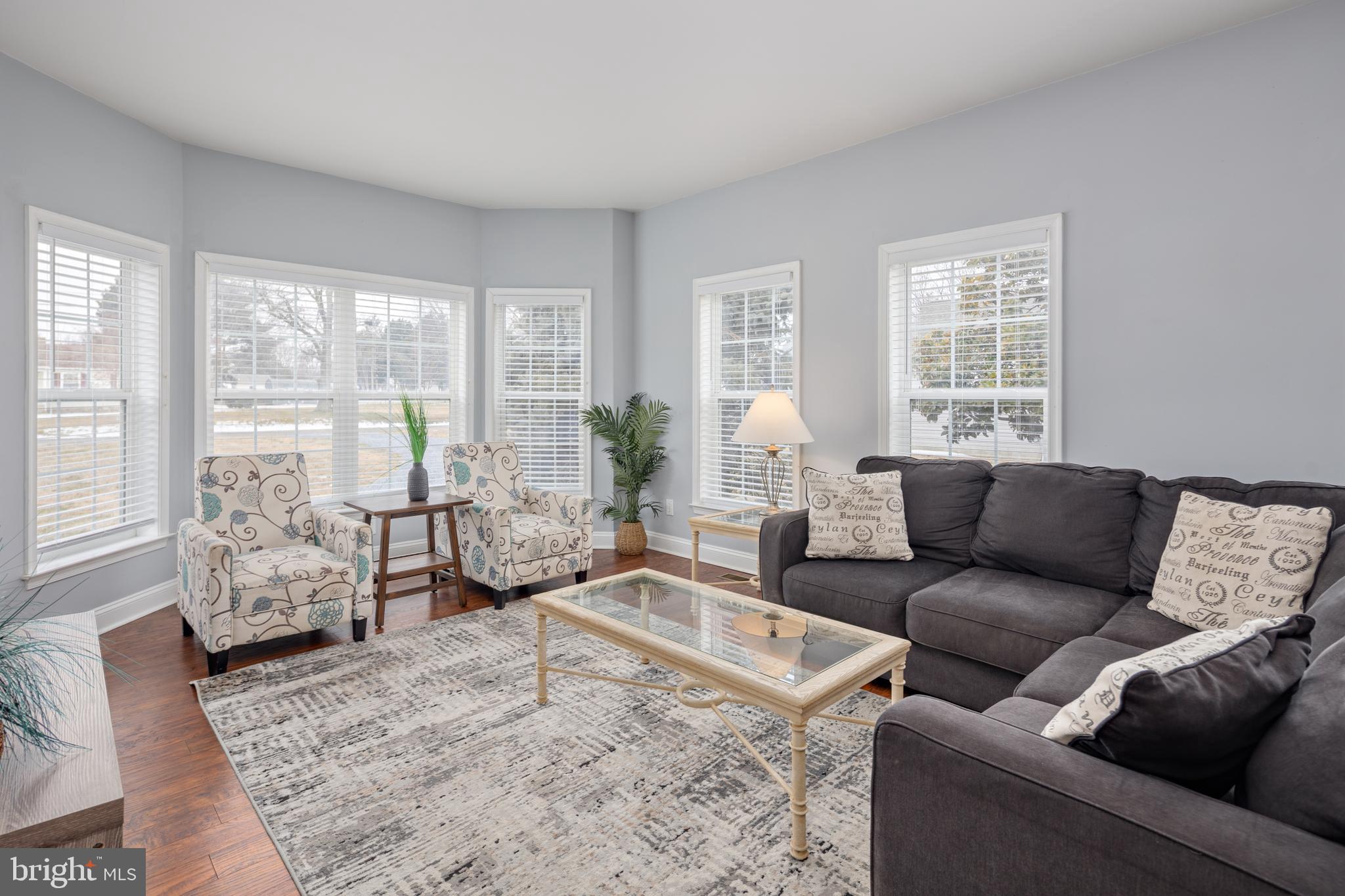 326 South Carolina Road Stevensville, MD 21666 - Photo 2 of 48 a living room with furniture and large windows