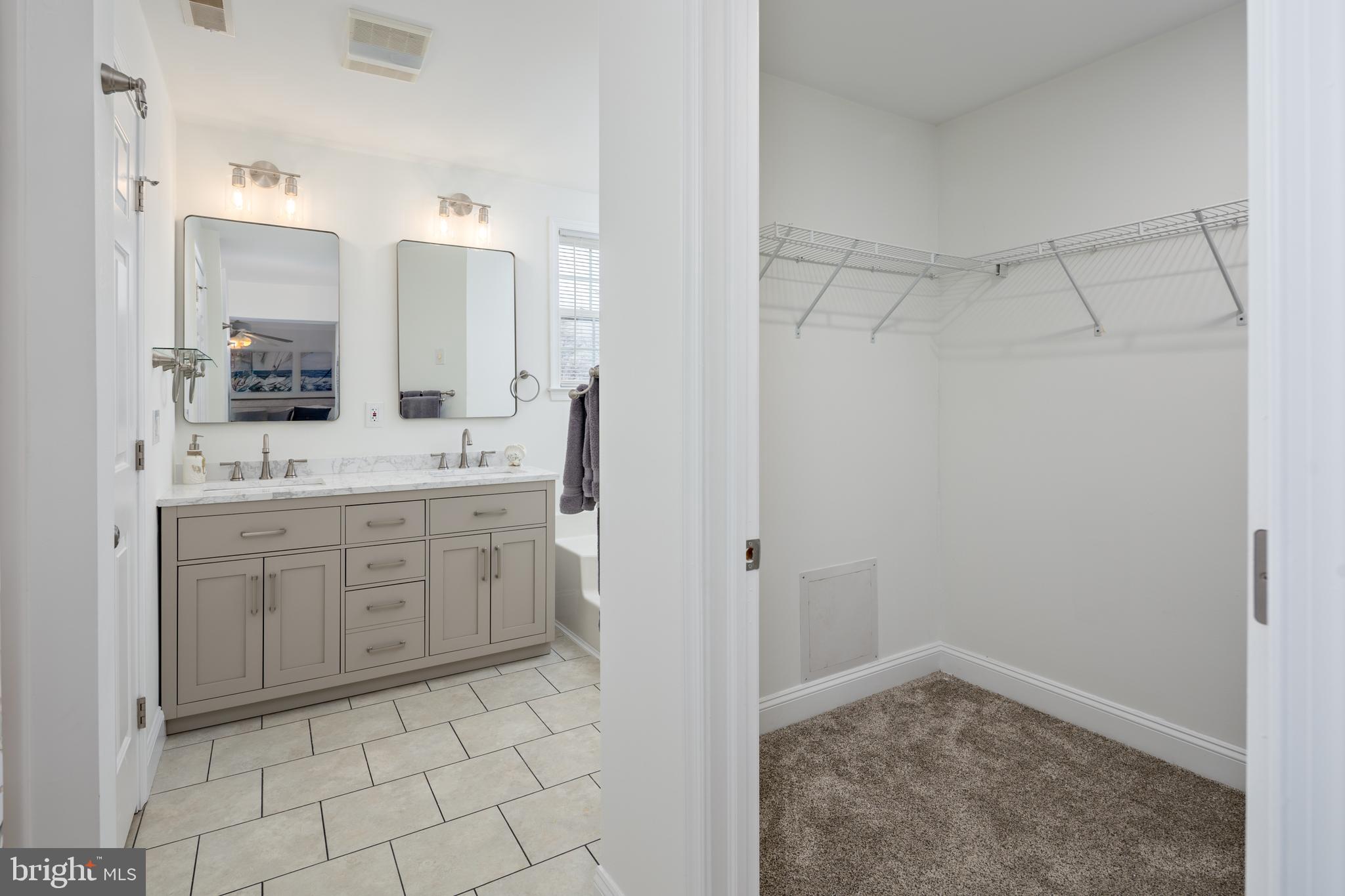 326 South Carolina Road Stevensville, MD 21666 - Photo 22 of 48 a bathroom with a sink a vanity and a mirror