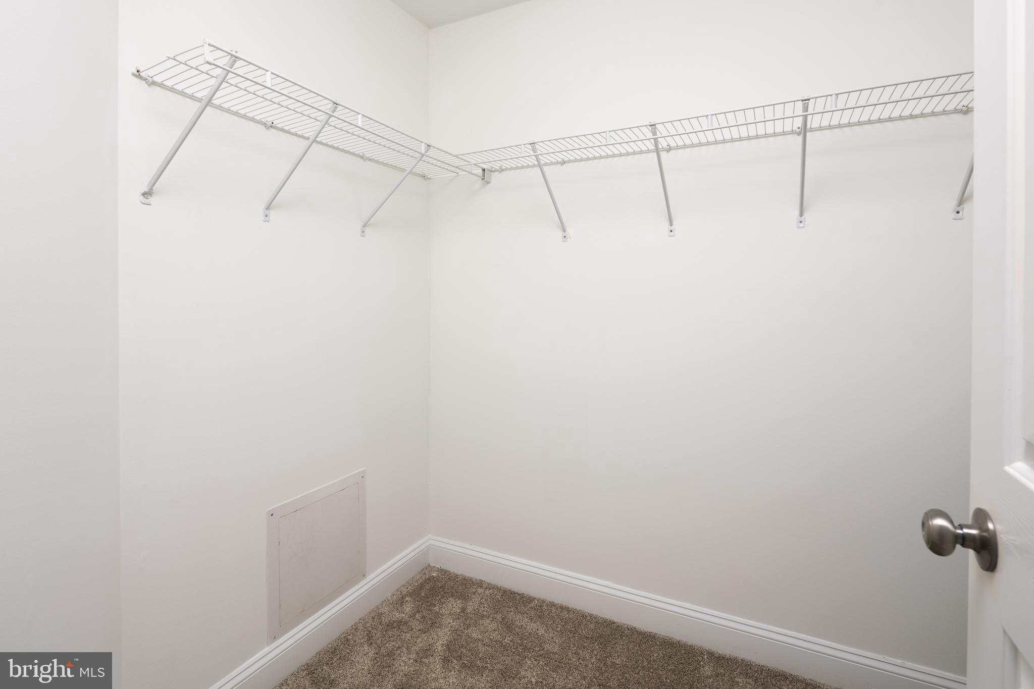 326 South Carolina Road Stevensville, MD 21666 - Photo 27 of 48 a view of a room with racks on the wall