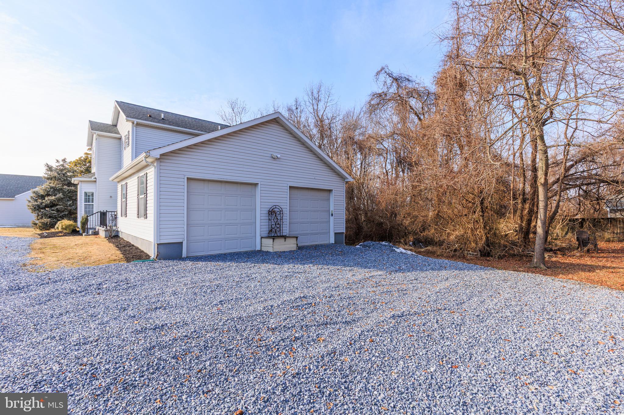 326 South Carolina Road Stevensville, MD 21666 - Photo 37 of 48 a view of a house with a yard and garage