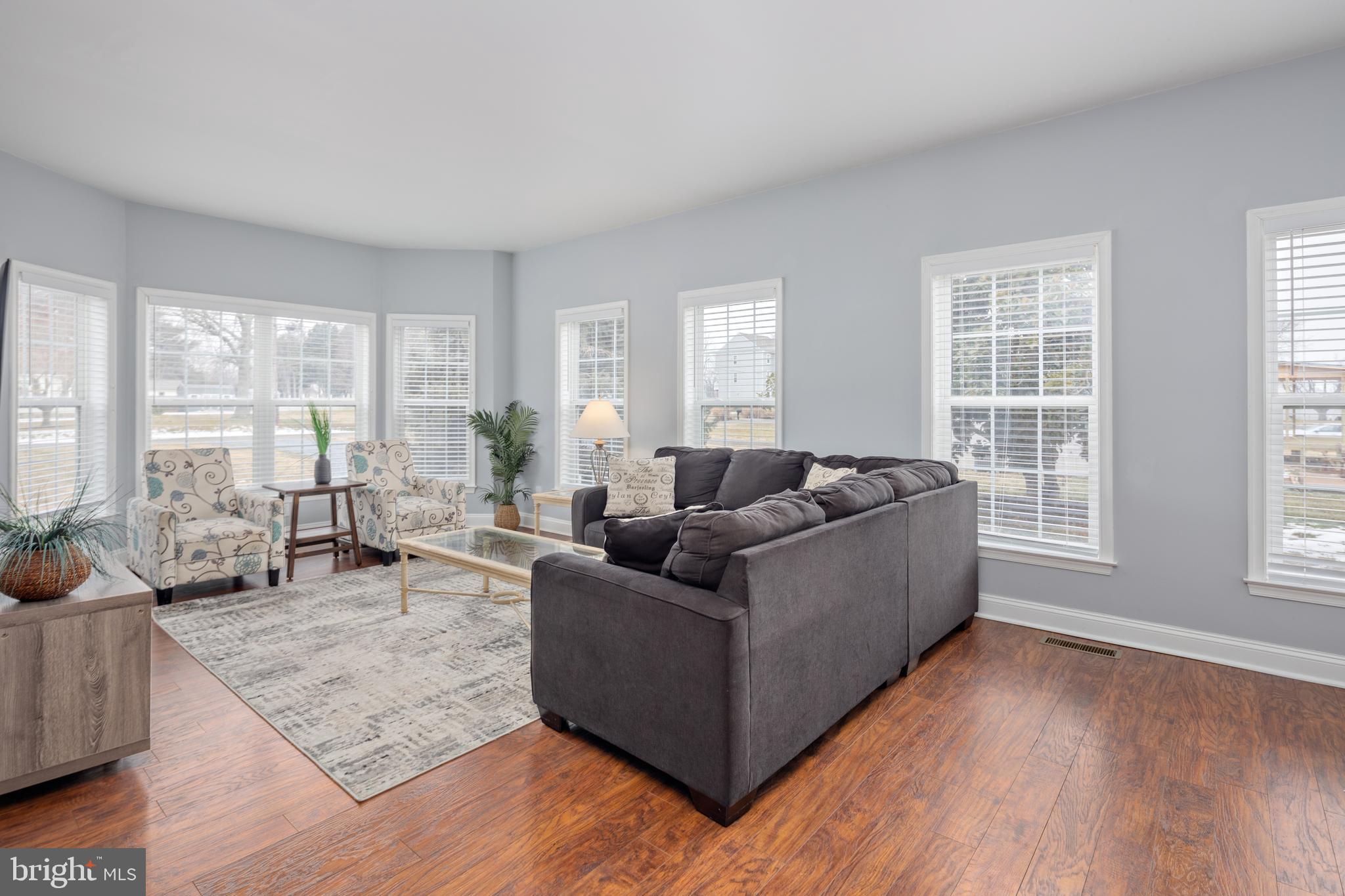 326 South Carolina Road Stevensville, MD 21666 - Photo 6 of 48 a living room with furniture and large windows
