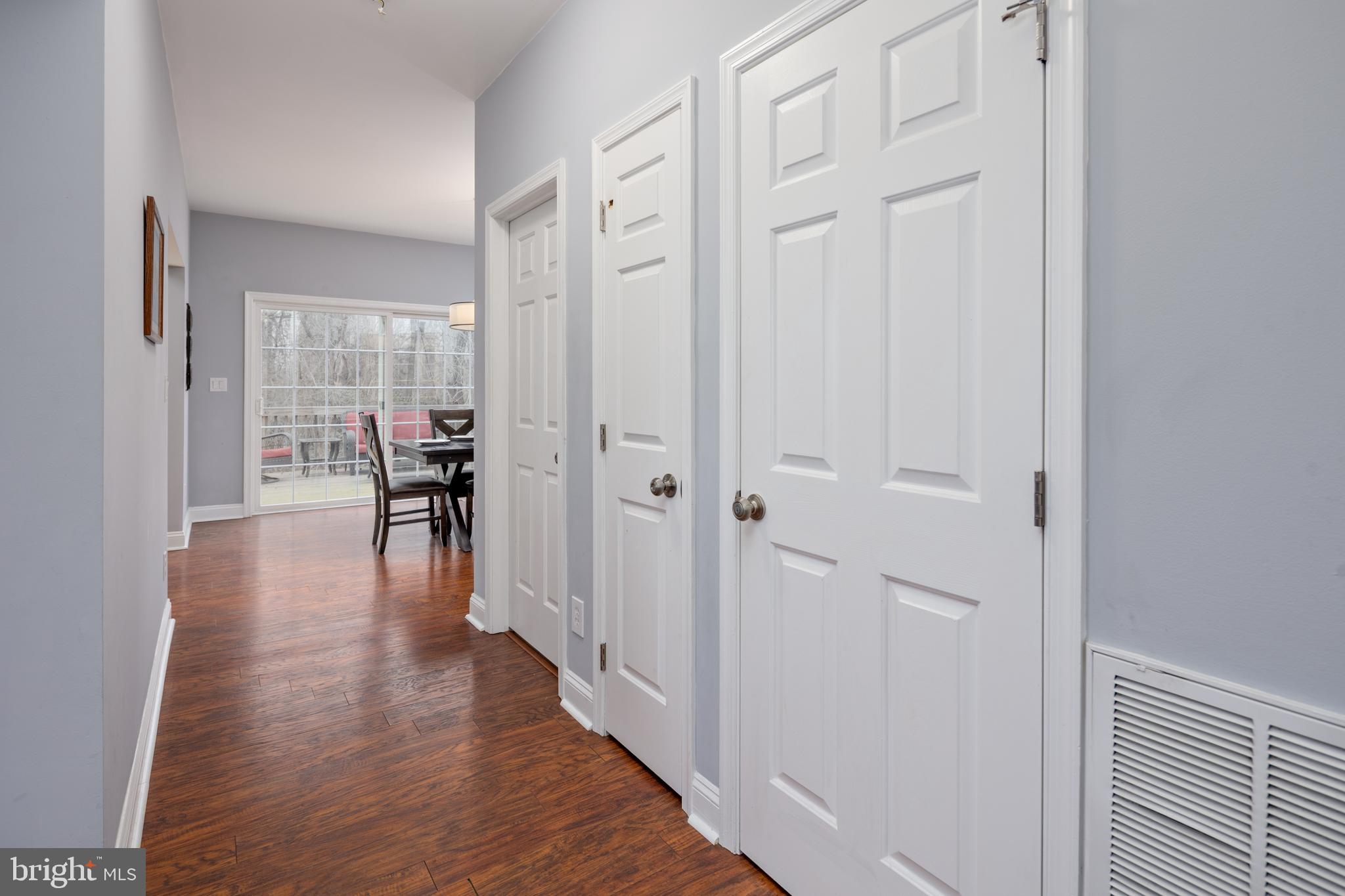 326 South Carolina Road Stevensville, MD 21666 - Photo 8 of 48 a hallway with wooden floor furniture and windows