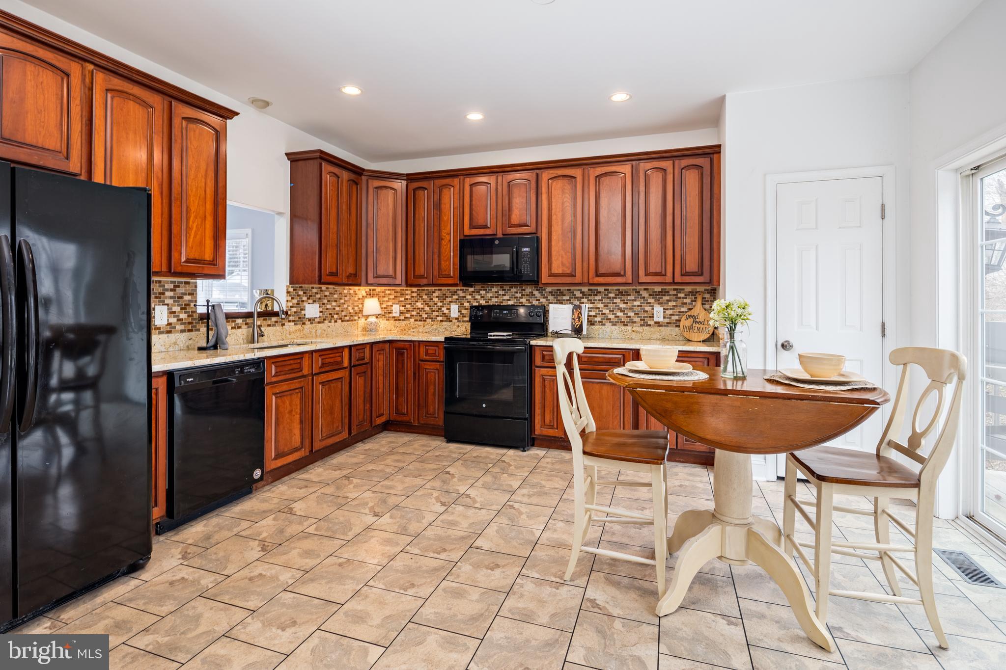 326 South Carolina Road Stevensville, MD 21666 - Photo 10 of 48 a kitchen with stainless steel appliances granite countertop a sink counter space cabinets and a counter top space