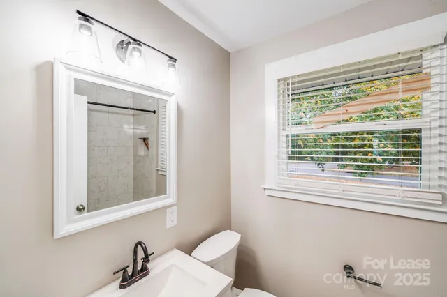 a bathroom with a sink and shower