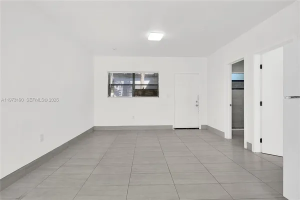 an empty room with a bathroom