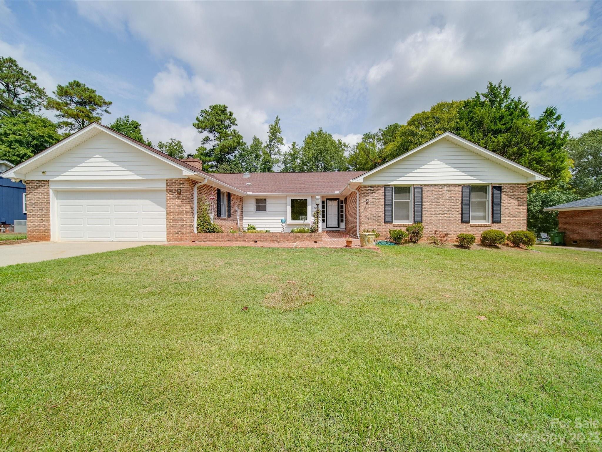 1296 Craig Avenue Lancaster, SC 29720 - Photo 1 of 31 a front view of a house with a yard and trees