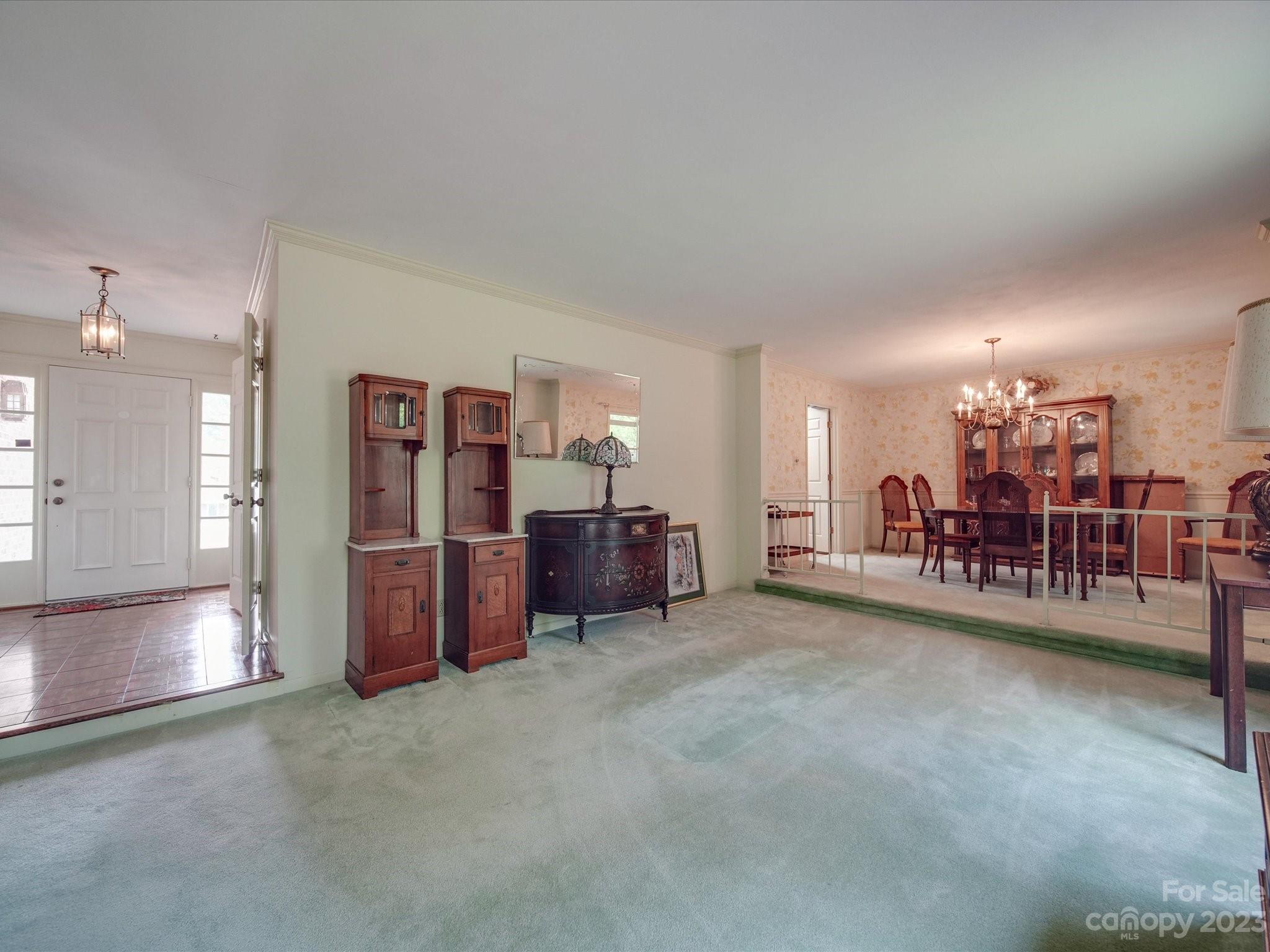 1296 Craig Avenue Lancaster, SC 29720 - Photo 13 of 31 a room with lots of furniture and a chandelier