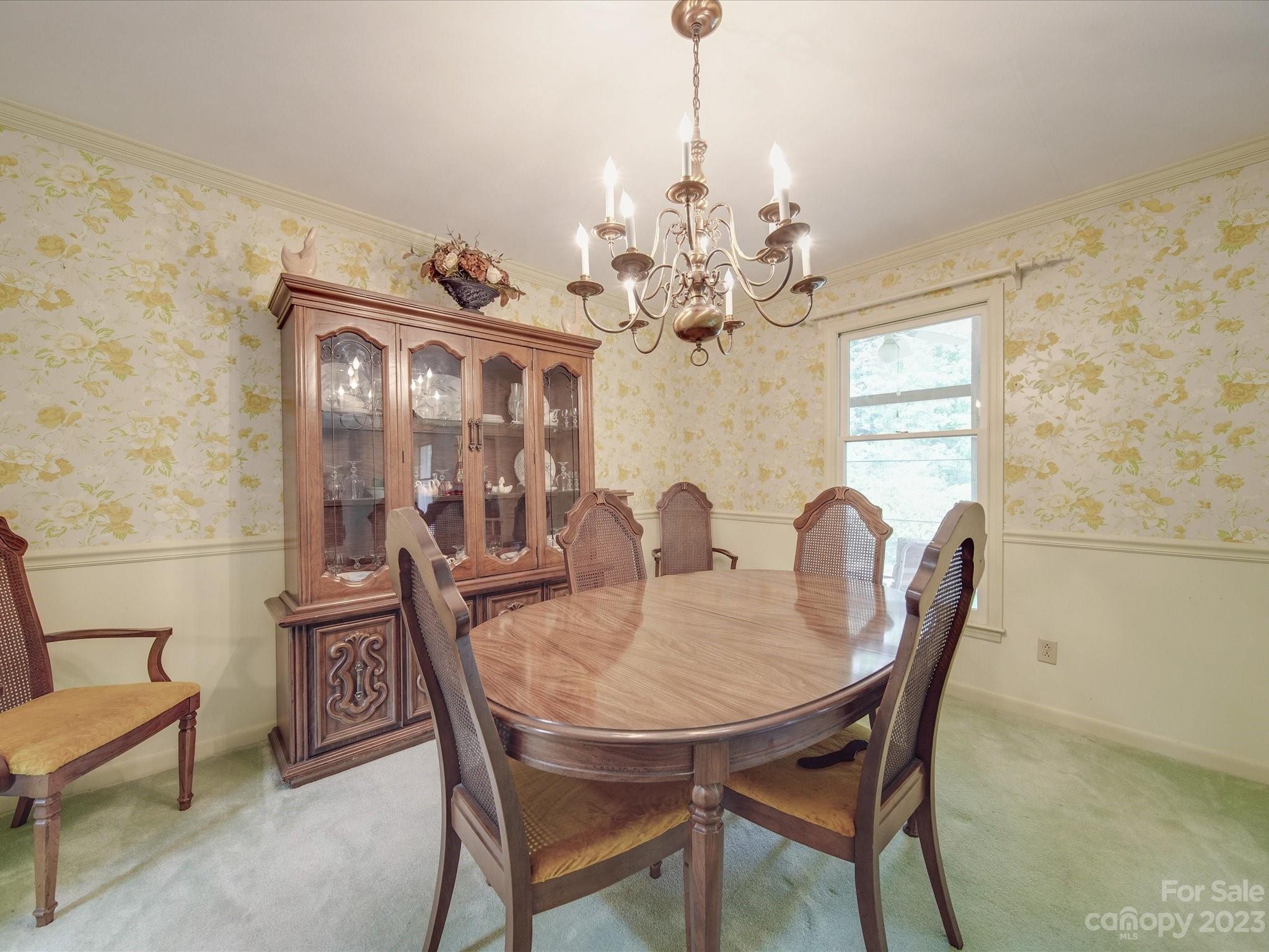 1296 Craig Avenue Lancaster, SC 29720 - Photo 16 of 31 a view of a dining room with furniture and chandelier