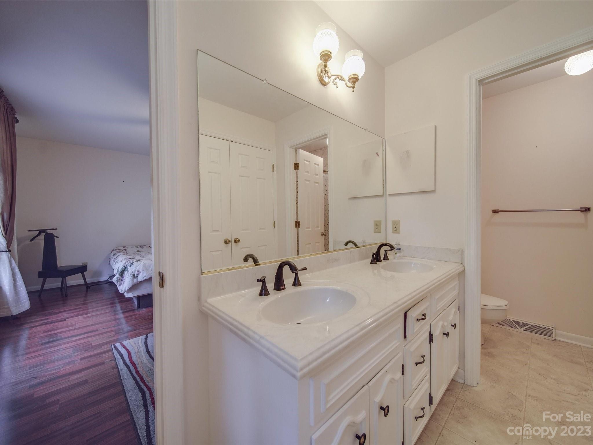 1296 Craig Avenue Lancaster, SC 29720 - Photo 22 of 31 a bathroom with double vanity sink and a mirror