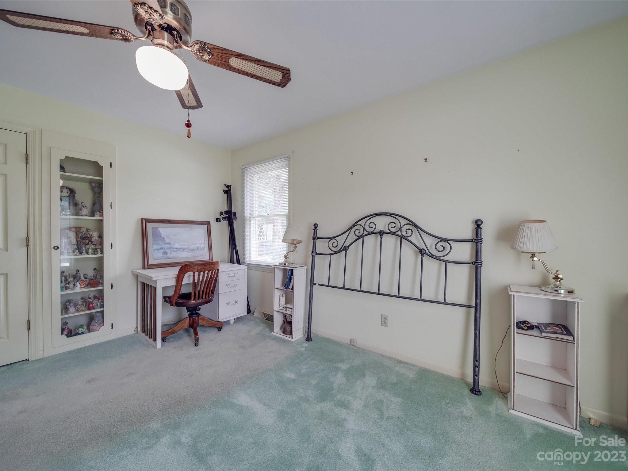 1296 Craig Avenue Lancaster, SC 29720 - Photo 26 of 31 a bedroom with furniture and a chandelier fan