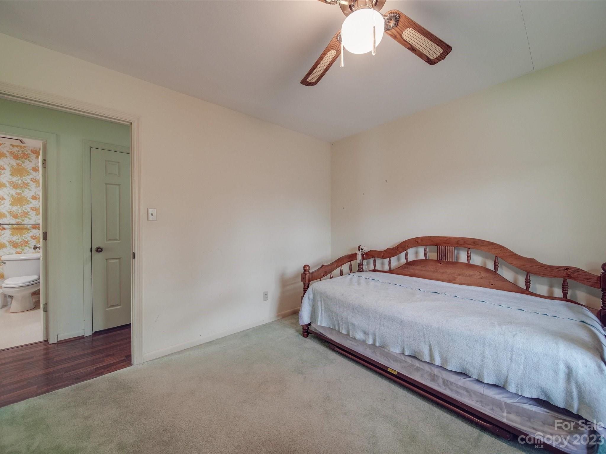 1296 Craig Avenue Lancaster, SC 29720 - Photo 27 of 31 a bed sitting in a bedroom next to a window