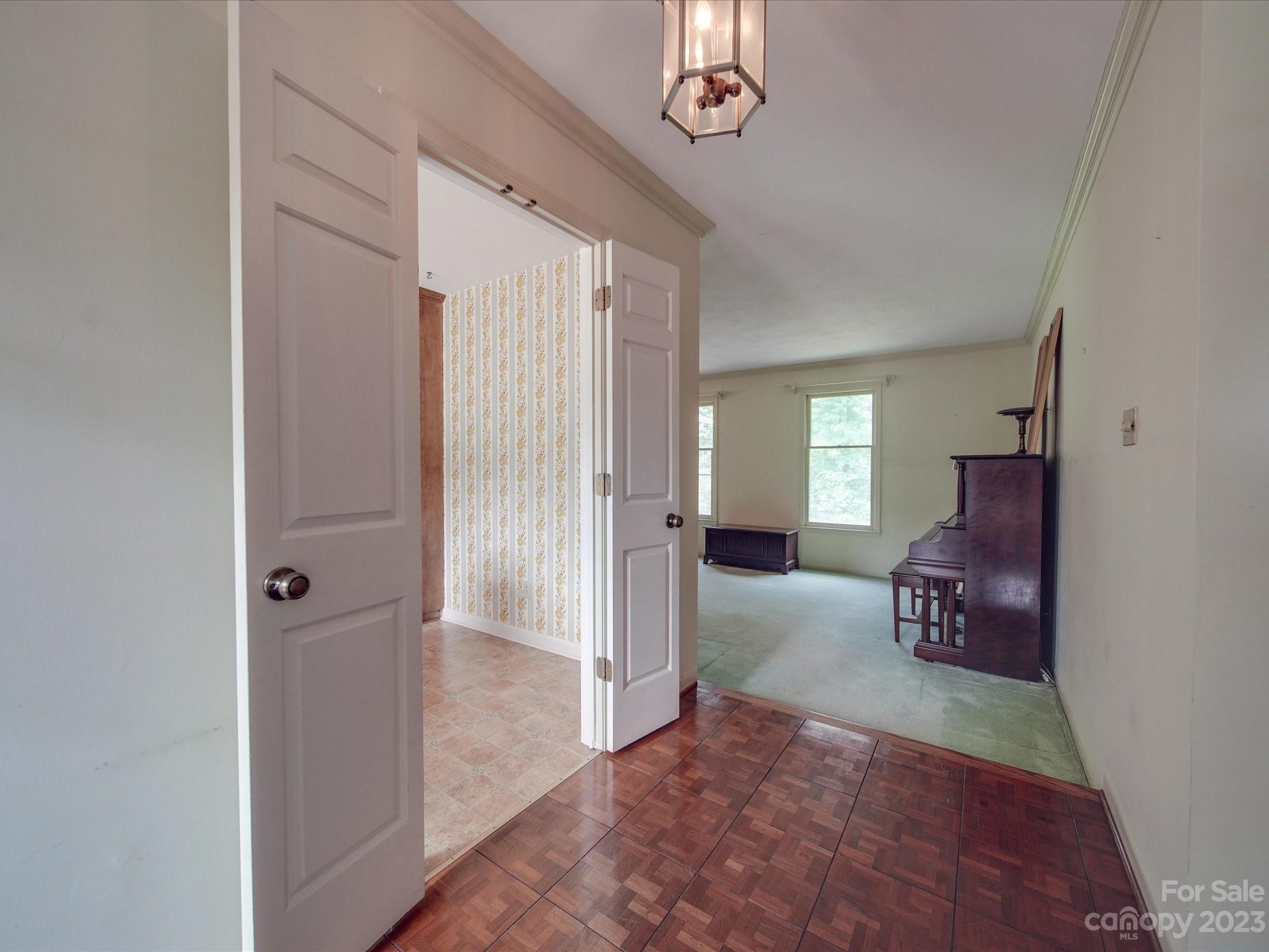 1296 Craig Avenue Lancaster, SC 29720 - Photo 6 of 31 a living room with furniture and a chandelier