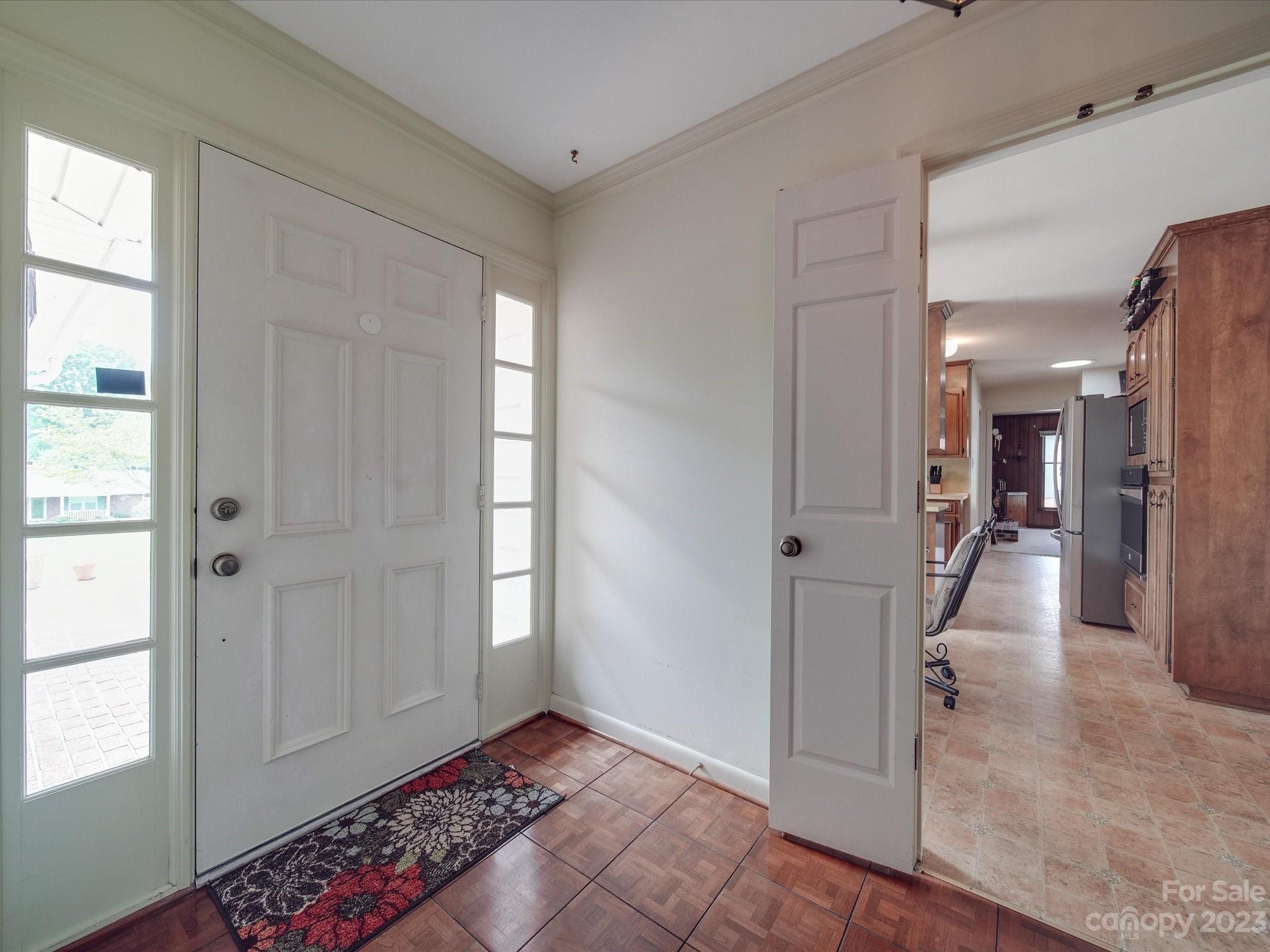 1296 Craig Avenue Lancaster, SC 29720 - Photo 7 of 31 a view of a hallway with wooden floor and a bathroom