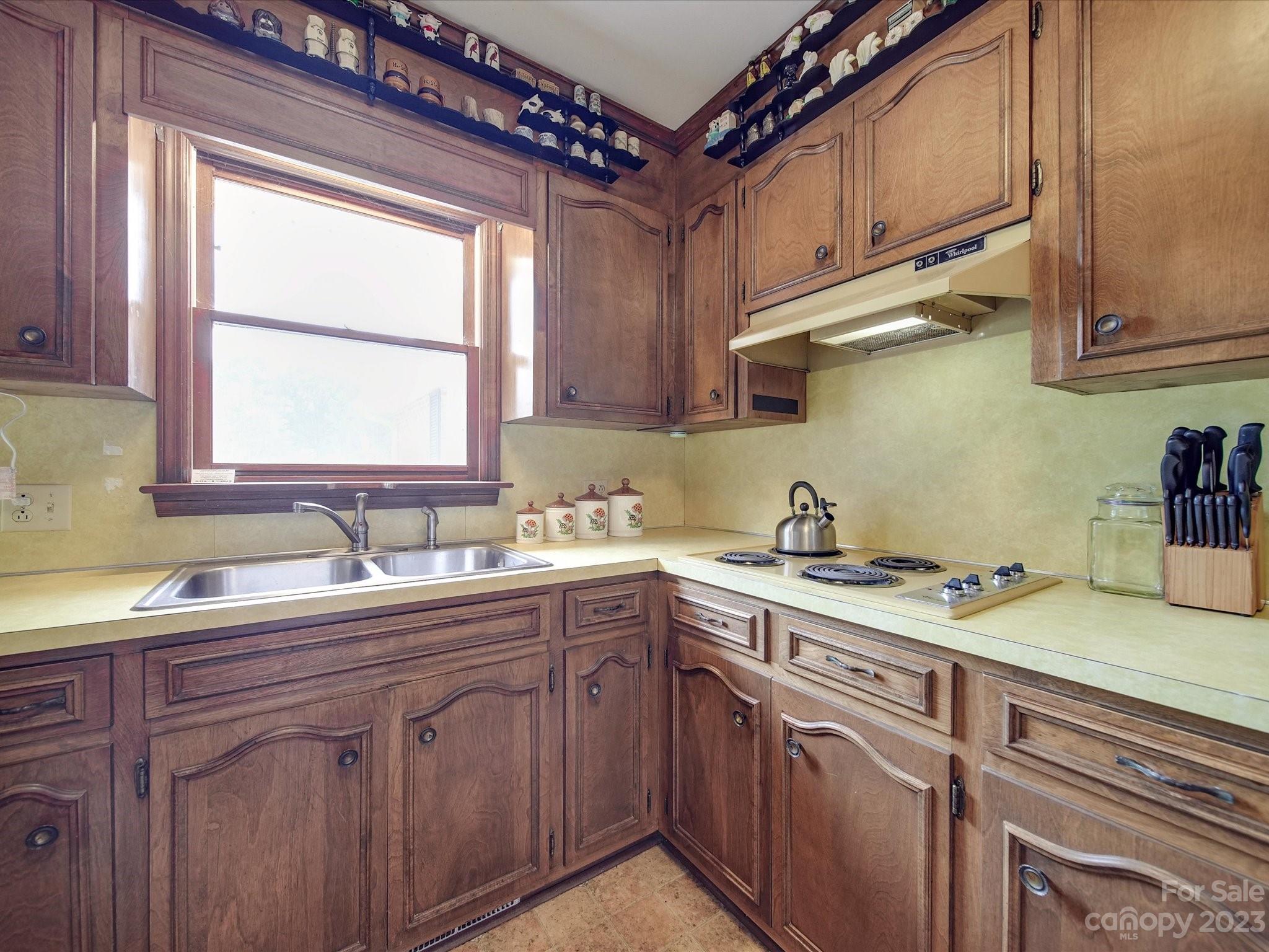 1296 Craig Avenue Lancaster, SC 29720 - Photo 10 of 31 a kitchen with a sink a window and cabinets