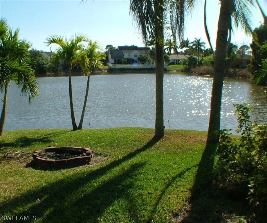 17240 Trellis Road Fort Myers, FL 33967 - Photo 6 of 12 a view of a lake with a yard