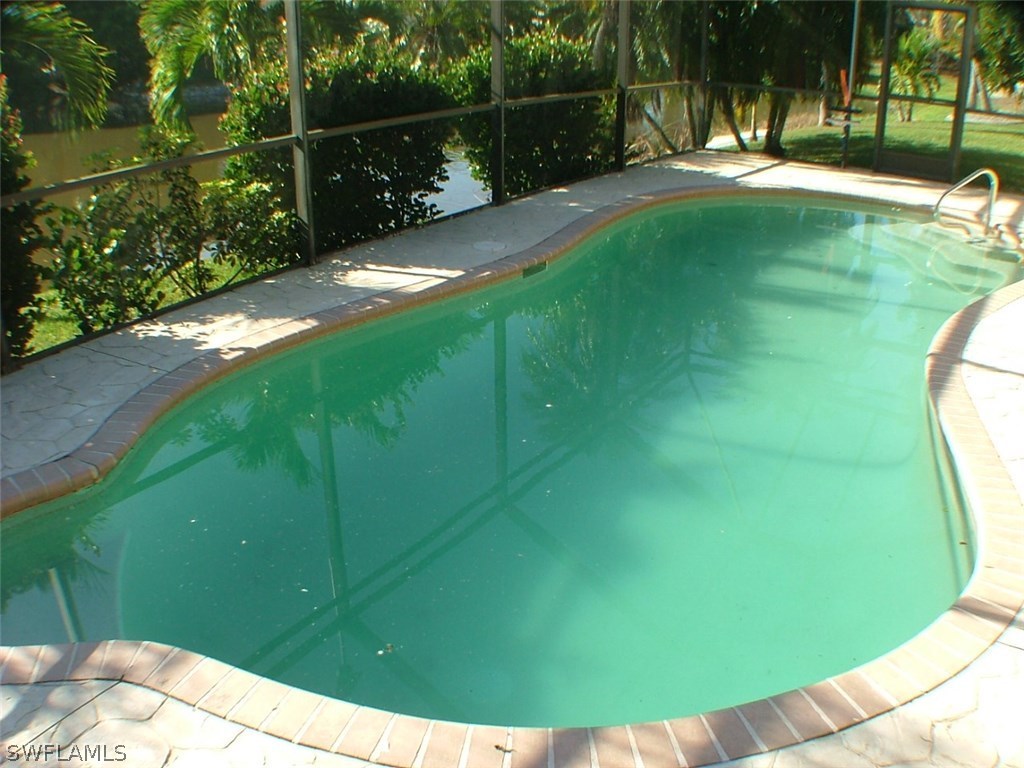 17240 Trellis Road Fort Myers, FL 33967 - Photo 10 of 12 a view of swimming pool from a garden