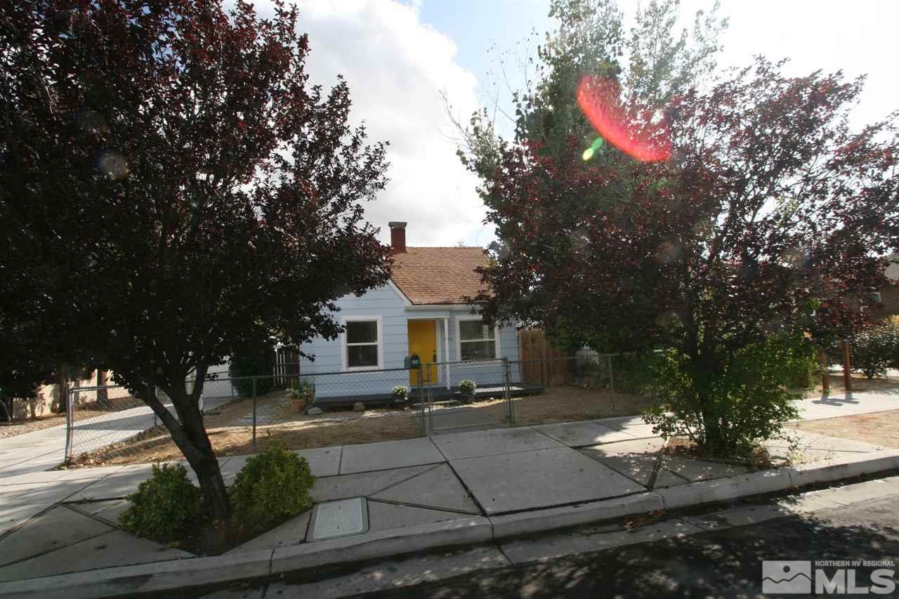 620 Thoma Street Reno, NV 89502 - Photo 2 of 13 a front view of a house with garden