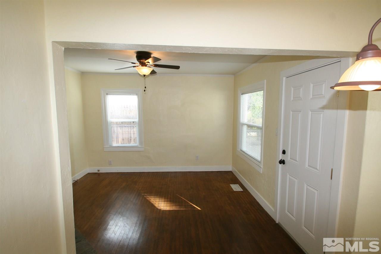 620 Thoma Street Reno, NV 89502 - Photo 3 of 13 an empty room with windows and fan
