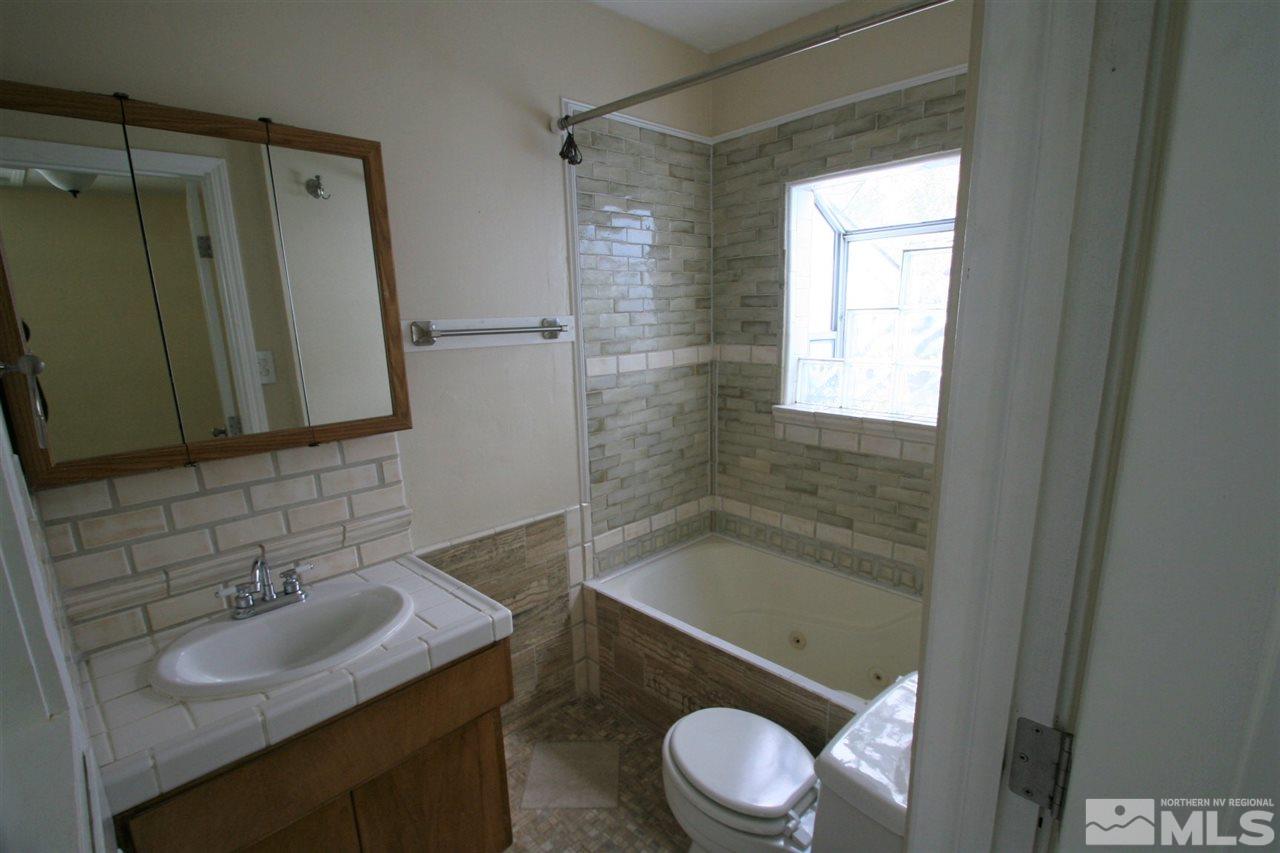 620 Thoma Street Reno, NV 89502 - Photo 6 of 13 a bathroom with a sink toilet and shower