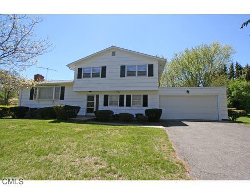 14 Haverhill Road Trumbull, CT 06611 - Photo 1 of 1 a front view of a house with a garden