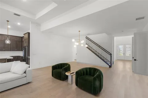 a spacious bedroom with a bed and a ceiling fan