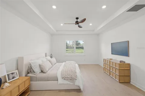 a bathroom with a double vanity sink mirror and a bathtub