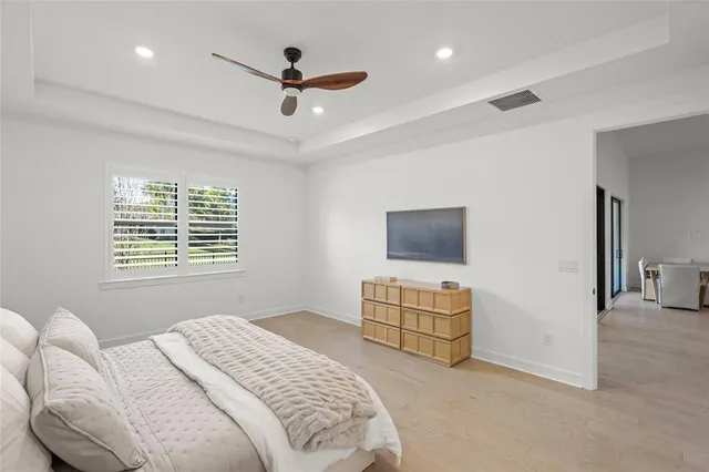 a bathroom with a shower and a glass door