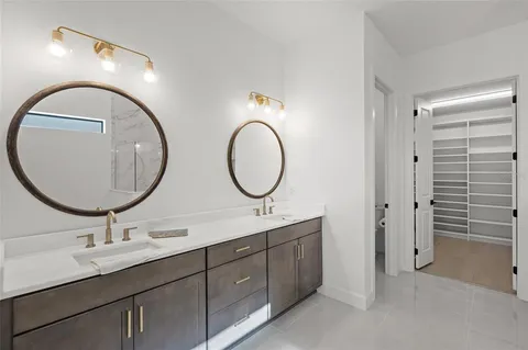 a bedroom with a bed and cabinets