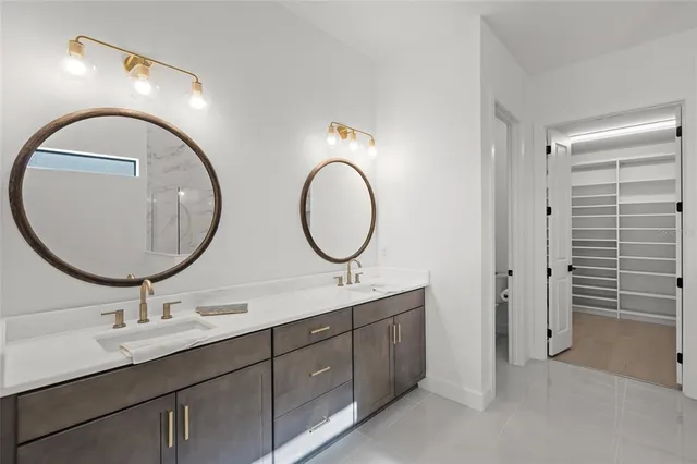 a bedroom with a bed and cabinets