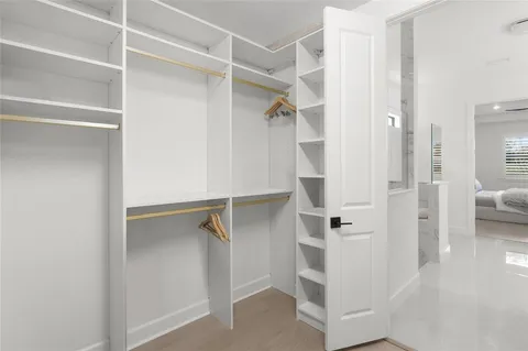 a bedroom with a bed and a cabinets