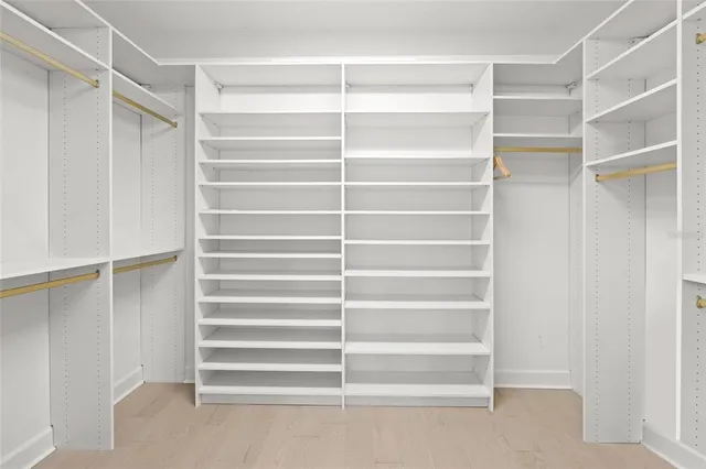 a bedroom with a bed and a furniture