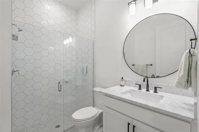 an empty room with large windows and a projector screen