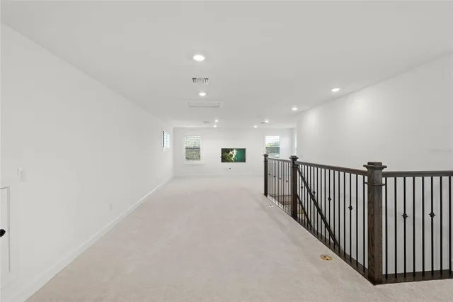 a front view of a house with a yard and glass windows