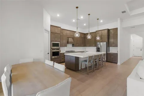 a living room with furniture and stairs