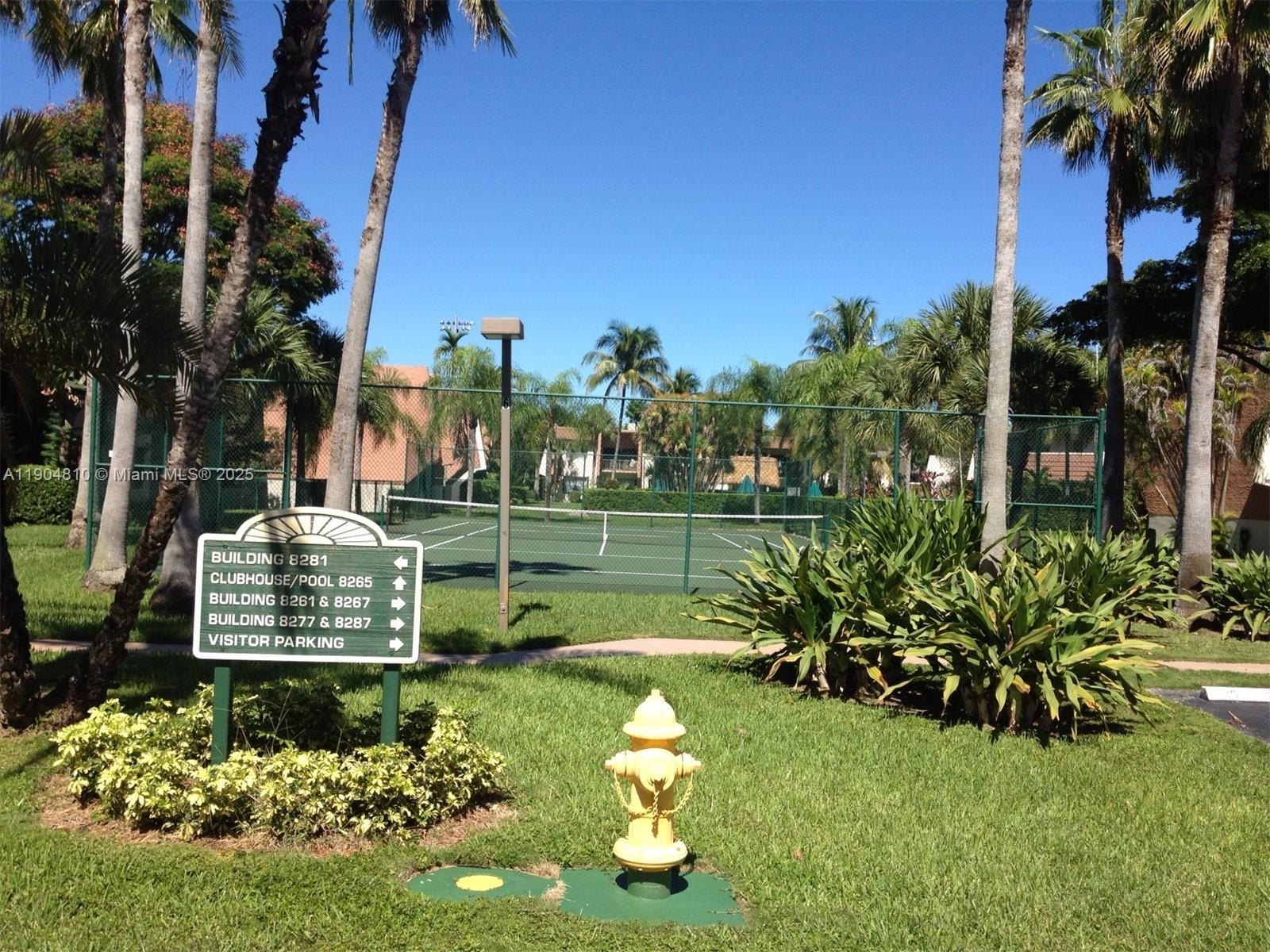 8281 Southwest 128th Street, Unit 107 Pinecrest, FL 33156 - Photo 2 of 3 a view of a garden