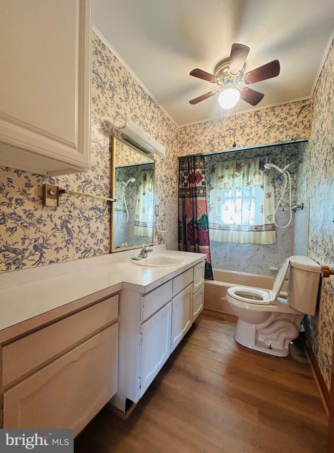 1843 Heide Cooper Road Shanks, WV 26761 - Photo 12 of 23 a bathroom with a granite countertop sink mirror vanity and bathtub
