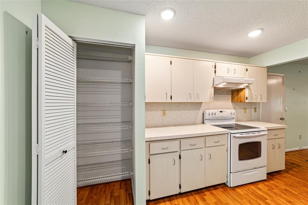 8678 Southwest 95 Street, Unit D Ocala, FL 34481 - Photo 16 of 36 a view of a kitchen with a stove top oven
