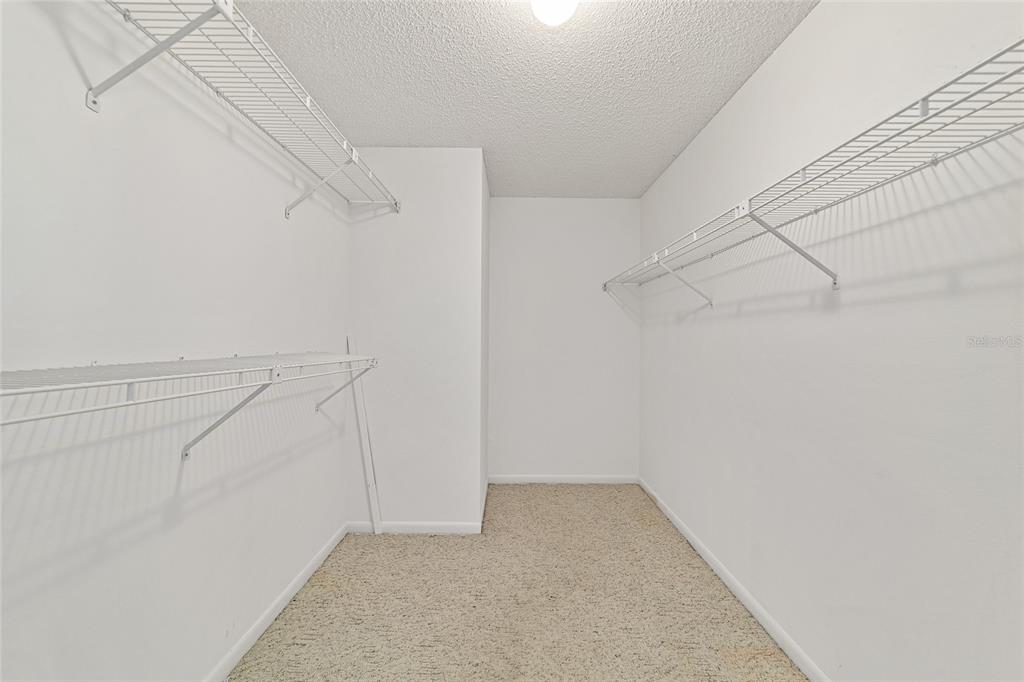 8678 Southwest 95 Street, Unit D Ocala, FL 34481 - Photo 21 of 36 a view of a room with racks on the wall